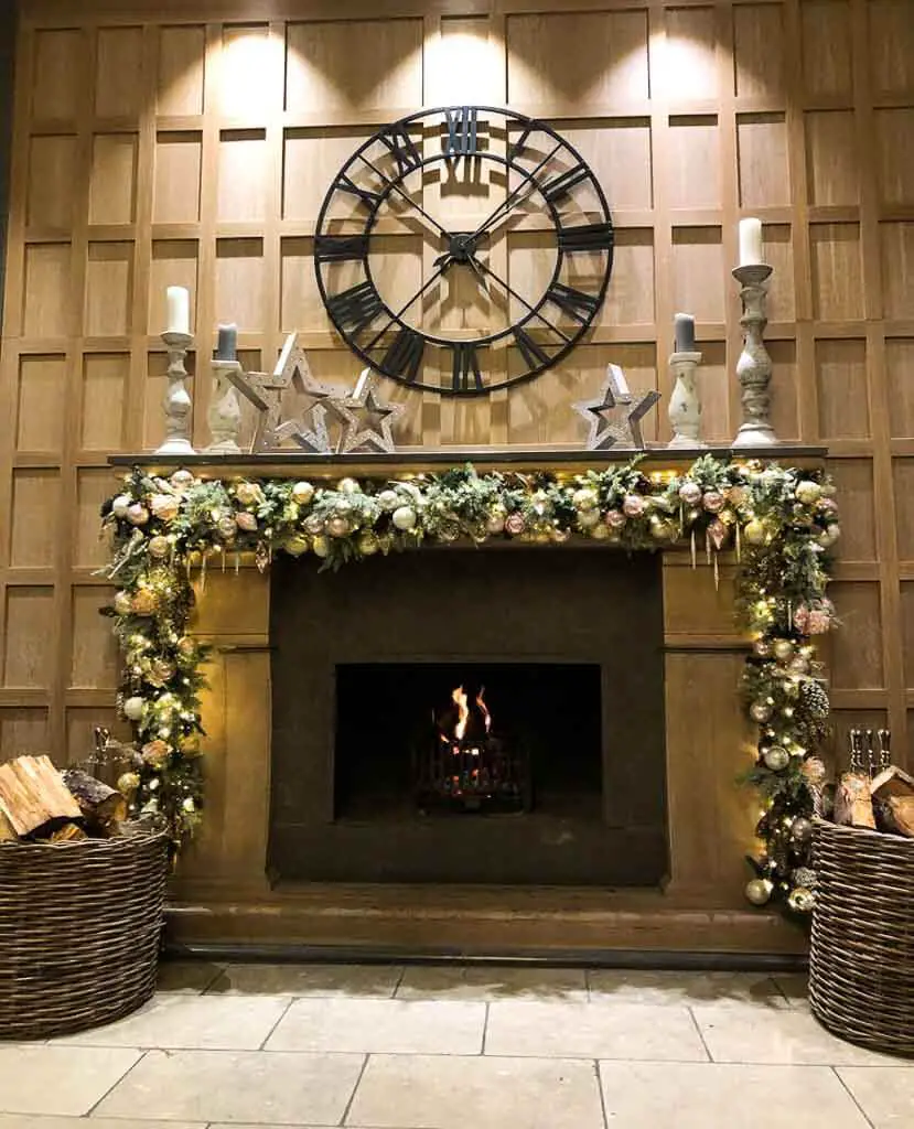 fireplace decorated for christmas at the Belfry Hotel