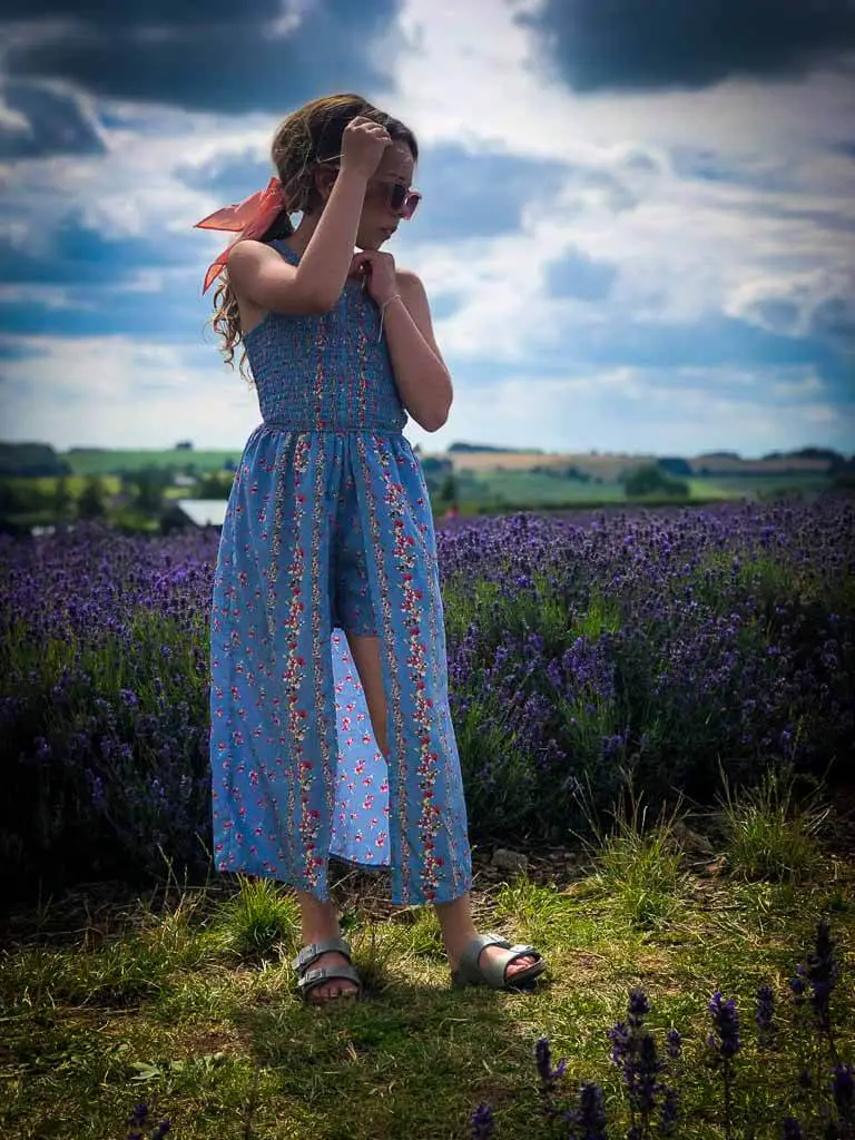 girl in floaty lilac dress posing at snowshill lavender farm