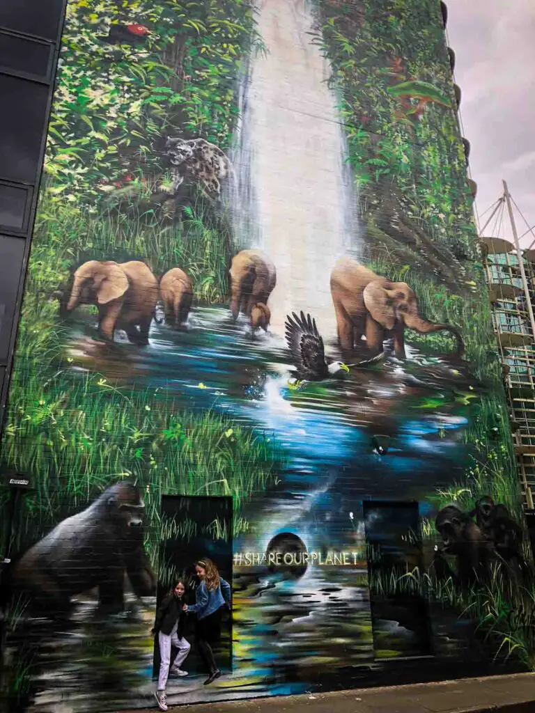 street art mural of a waterfall and elephants