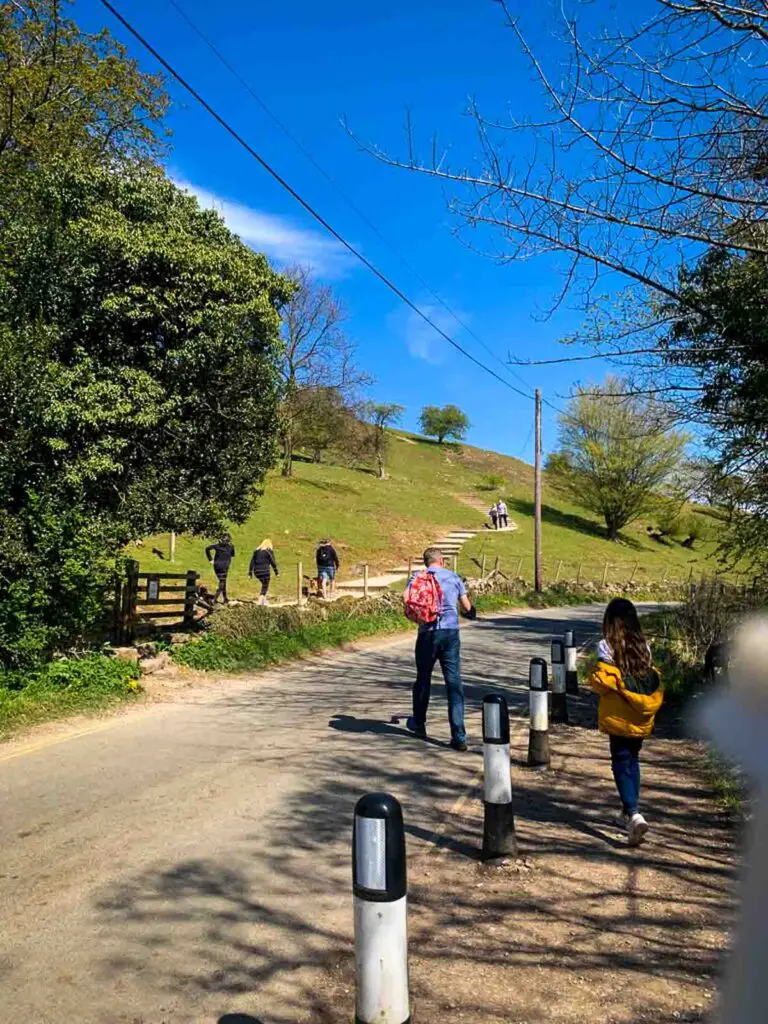 girl and dad crossing rood in Ilam
