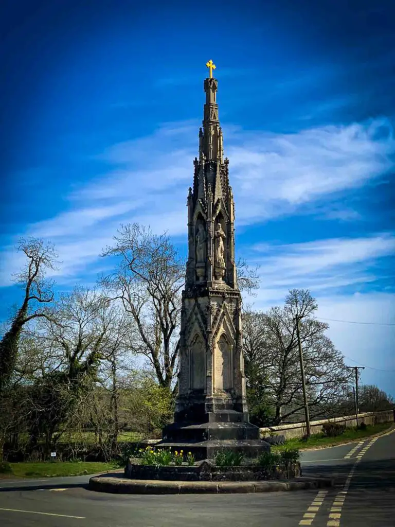the Ilam cross monument against a blue sky