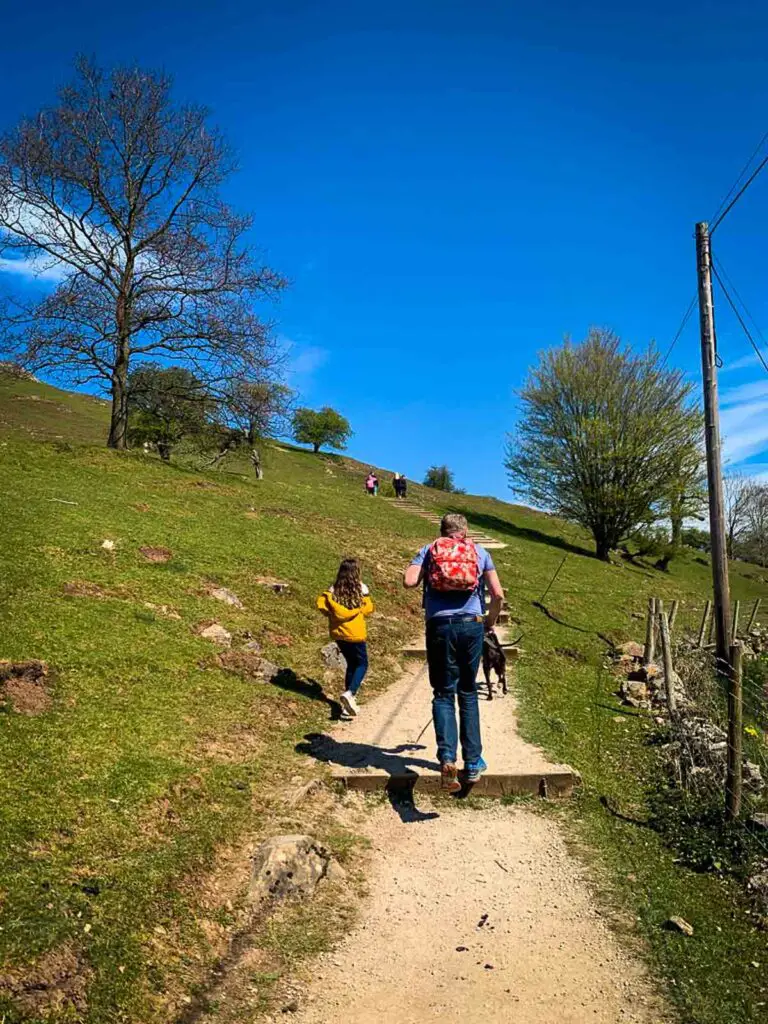 girl and father carrying a backpack walking the ilam dovedale loop