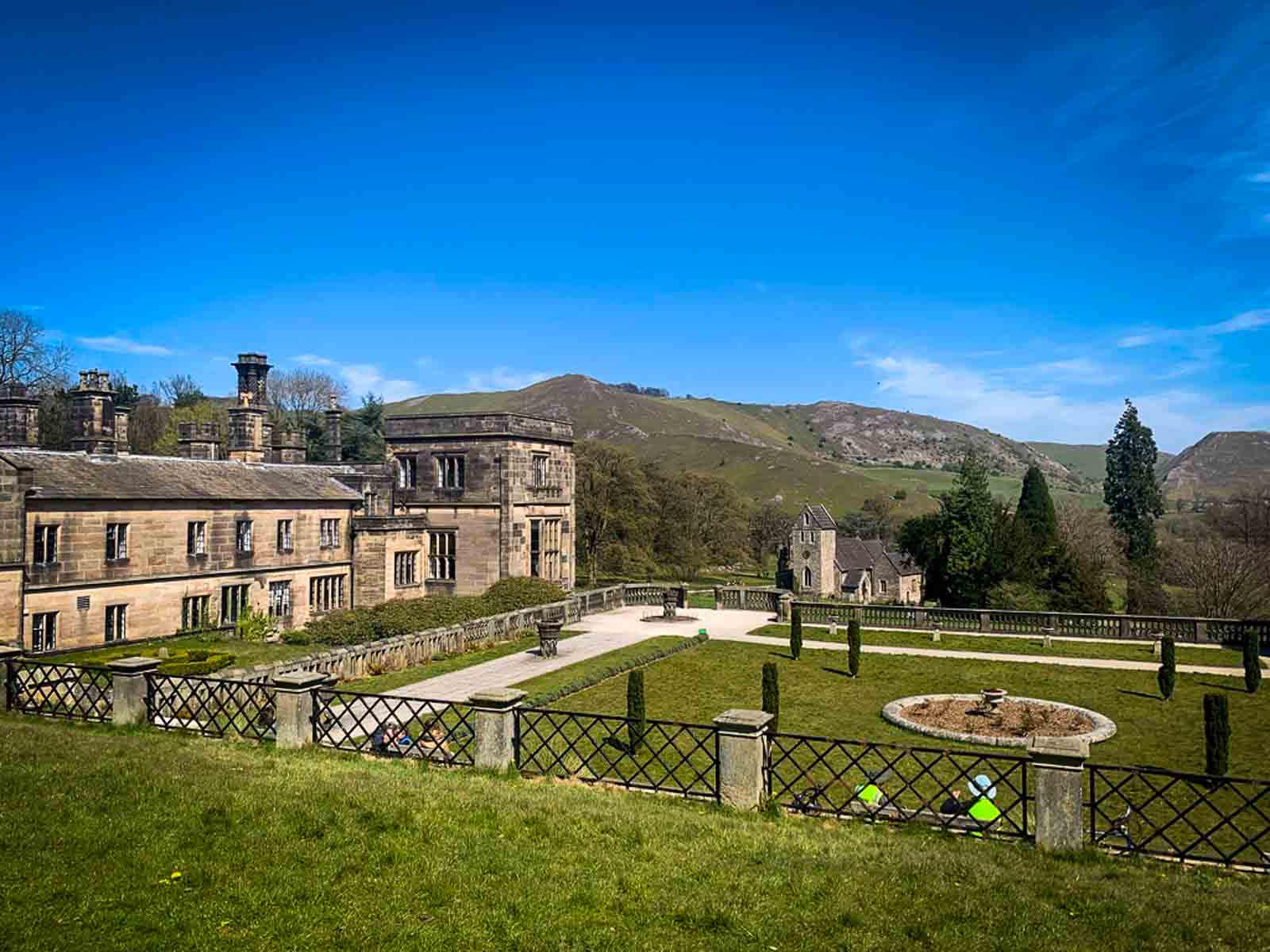 view of ilam hall stately home across the italian gardens