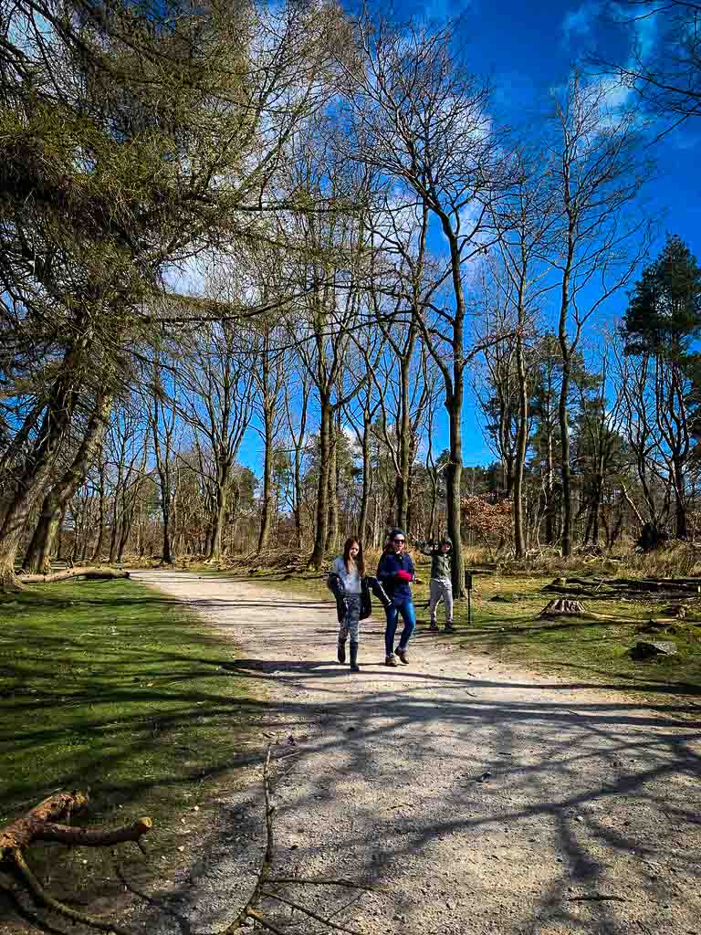 three kids walking along a path at padley gorge