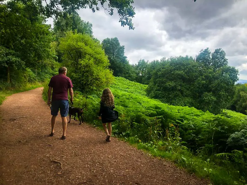 father and daughter walking in client hills