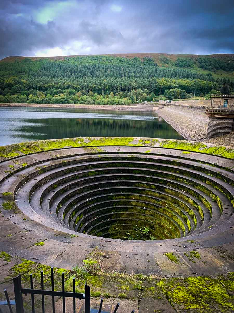 plug hole covered in moss at ladybower dam
